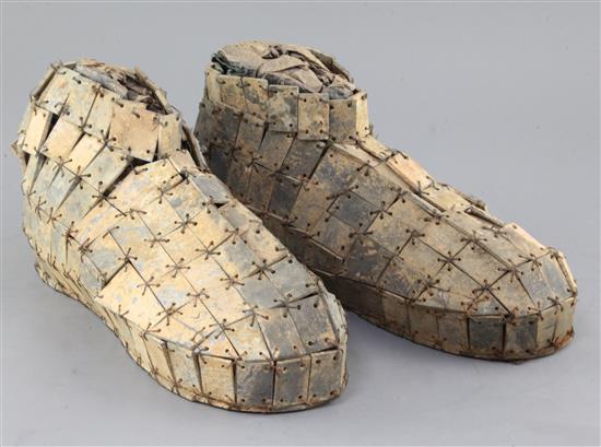 A pair of Chinese archaic sectional grey-green jade shoes, probably Han dynasty, 28cm long